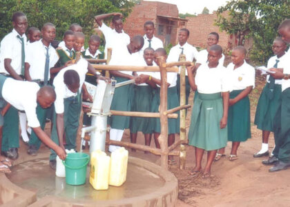 students-at-borehole-St.-Matia-Mulumba