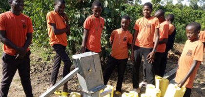 Students at borehole in Uganda, St. Matthias Mbuye