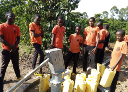 Students at borehole in Uganda, St. Matthias Mbuye